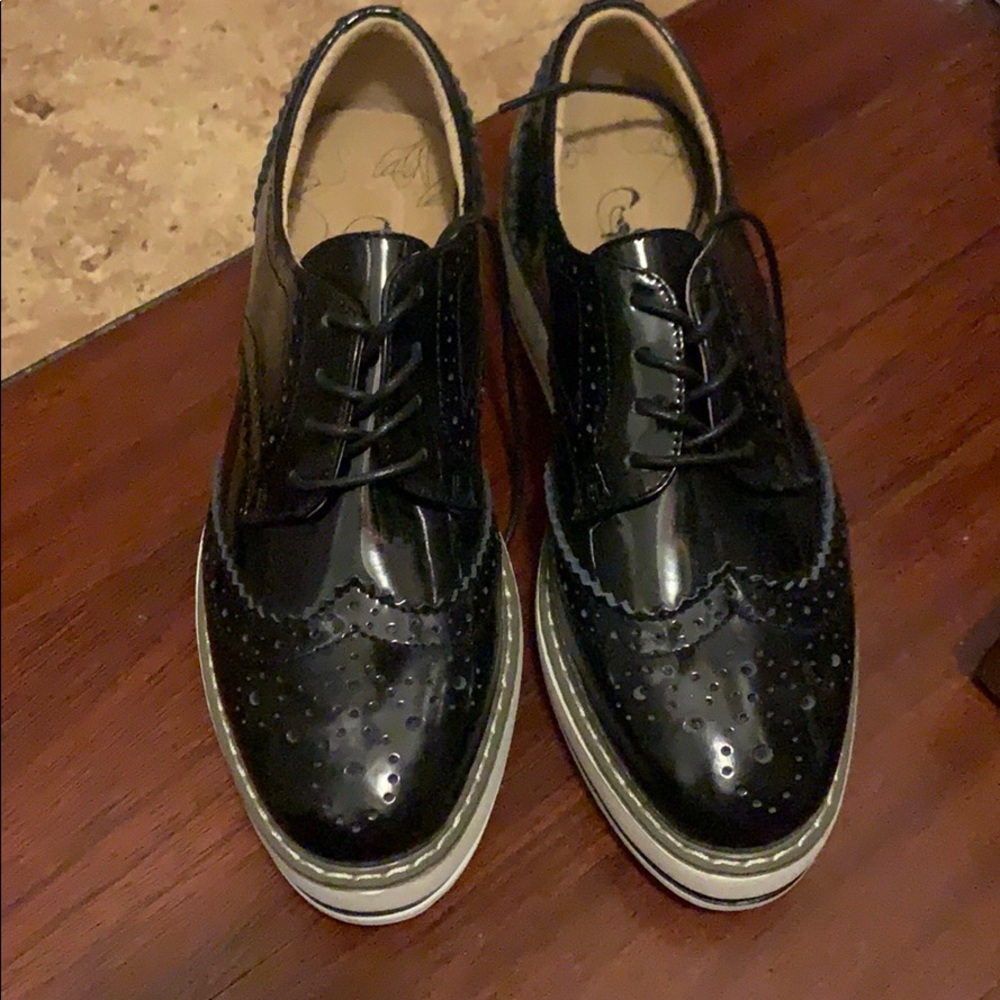 Size 6.5 black platform loafers. Never been worn